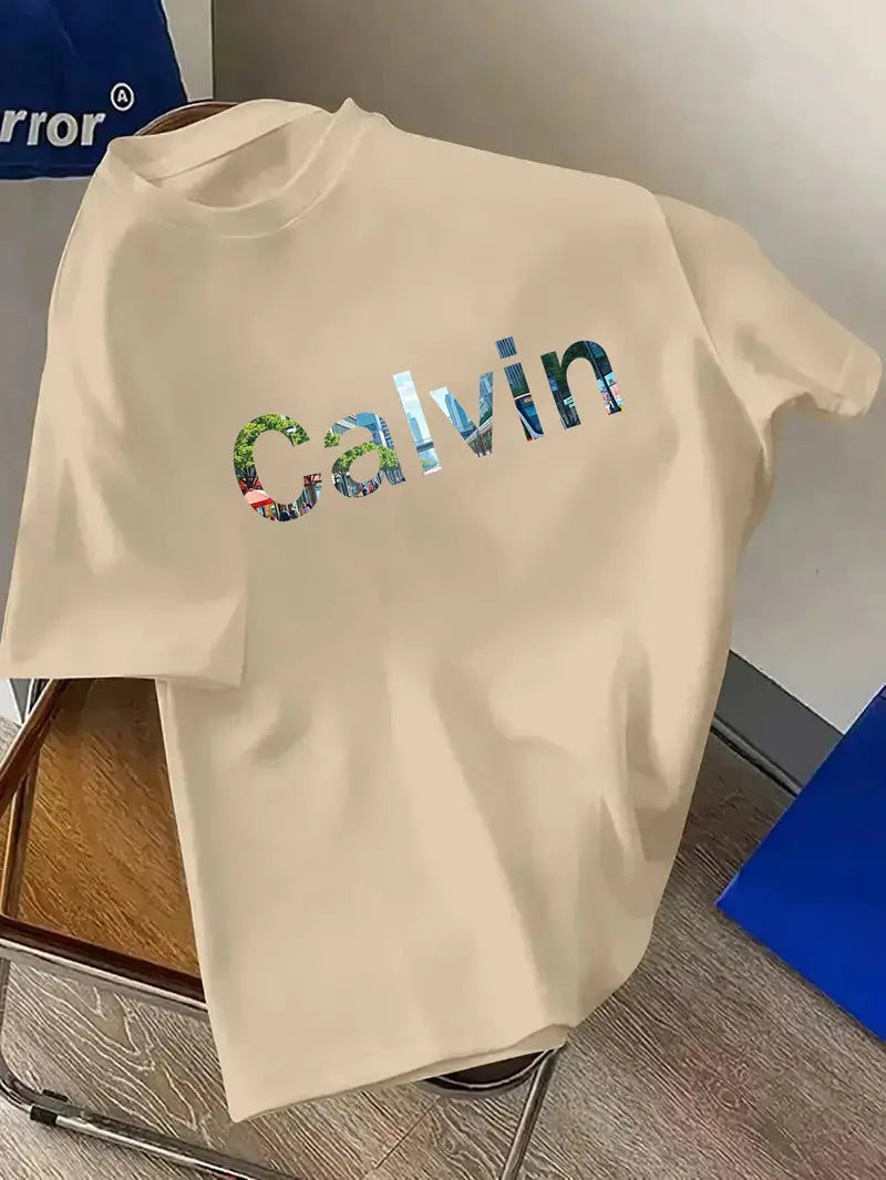CALVIN Maglietta Casual da Uomo Nera con Grafica di Lettere Audaci - Girocollo in Poliestere Morbido per Abbigliamento Estivo Urbano, Lavabile in Macchina per l'Uso Quotidiano